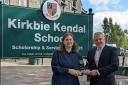 Glenn Bond, director of financial services, Lamont Pridmore Asset and Wealth Management, presents the Business Student of the Year award to Sasha Bernada