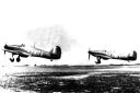 Two RAF Hawker Hurricane MK1 fighters from RAF 79 Squadron taking off from RAF Hawkinge, Kent during the Battle of Britain. Photo: PA