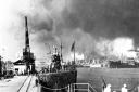 USS Tautog (SS 199) left, and USS Narwhal (SS 53) right, at Pearl Harbor sub-base.