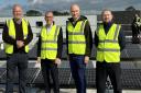 MP Bob Blackman (far left) with engineers installing rooftop solar panels at Stanmore leisure centre