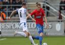 Matt Robinson of Dagenham and Redbridge and James Dunne of Southend United