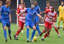 Barking defender Jay Leader holds the ball up against Ilford in the FA Cup