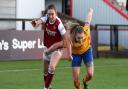 Arsenal's Lisa Evans (left) and Everton's Lucy Graham battle for the ball during the FA Women's Super League match at the Meadow Park, London.