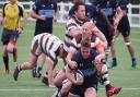 Jack Scorer of Eton Manor in action against Southend