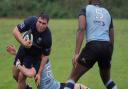 George Cosma of Eton Manor is tackled against Chingford