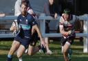 Scott Smith of Eton Manor with the ball against rivals Brentwood