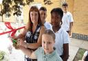 Headteacher Penny Martin opens the memorial garden with Mossford Primary School pupils