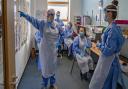 Nurses hold a meeting on a Covid-19 ward