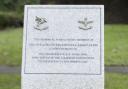 Members of the Ilford 84 branch of the Parachute Regimental Association with their memorial in Coronation Gardens, Romford