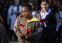 Brownies and Guides with their poppy tributes at the Remembrance Sunday service at Wanstead War Memorial