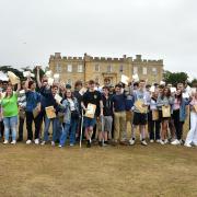 Kimbolton students celebrating their A-level results in front of the Castle