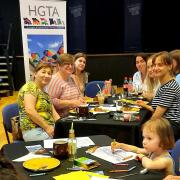 The Ukrainian children coloured in hand-drawn sheets of local town features during the HGTA welcome afternoon tea event.