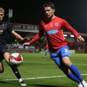 Callum Reynolds of Dagenham and Redbridge and Andy Smith of Salford City