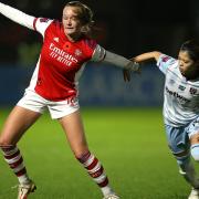 Arsenal's Frida Maanum (left) and West Ham United's Yui Hasegawa battle for the ball during the Barclays FA Women's Super League match at Meadow Park.