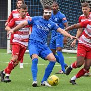 Barking defender Jay Leader holds the ball up against Ilford in the FA Cup