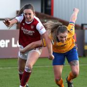 Arsenal's Lisa Evans (left) and Everton's Lucy Graham battle for the ball during the FA Women's Super League match at the Meadow Park, London.