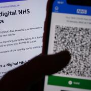 A person's NHS COVID domestic Pass is displayed on a smartphone screen within the NHS App