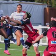 Toto Odulaja of Eton Manor in action against Amersham