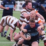 Jack Scorer of Eton Manor in action against Southend