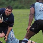 George Cosma of Eton Manor is tackled against Chingford