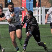 Jordan Sullivan-Warner of Eton Manor in action against Belsize Park