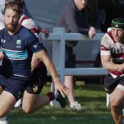 Scott Smith of Eton Manor with the ball against rivals Brentwood