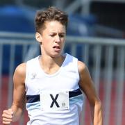 Joseph Grange of Ilford AC in racing action