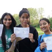 Beal High School pupils Maya Paul, Jade Patrick-Dunn, and Harlin Kaur celebrate their results.