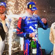 Goodmayes-born racer Alex Lynn is sprayed with champagne by race winner Jake Dennis after finishing third in the London E-Prix on Saturday (July 24).