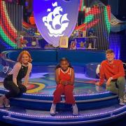 Nahla-Rose Bartlett-Vanderpuye in the Blue Peter studio with presenters Lindsey Russell and Adam Beales.