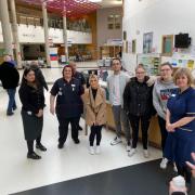 Georgia and Lewis pose with the hardworking NHS teams. Picture: Lewis and Georgia Holmes