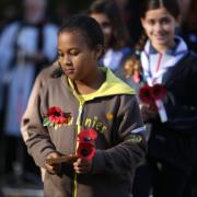 Brownies and Guides with their poppy tributes at the Remembrance Sunday service at Wanstead War Memorial