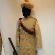 First World War uniform from India on display with a rifle at Redbridge Museum's First World War exhibition