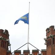 A flag is flown at half-mast at Bancroft's, independent school in Woodford Green, east London, where the 14-year-old boy killed in a sword attack in Hainault, is understood to have attended