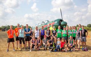 A selection of the 36 male and 30 female runners who participated in the 10k run alongside a Yak-52 aircraft