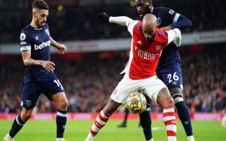 Arsenal's Alexandre Lacazette holds off West Ham United's Arthur Masuaku (right) during the Premier League match at Emirates Stadium