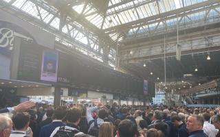 People to board train at London's Waterloo station